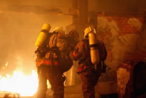 firefighters carrying an accident victim